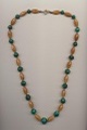 Necklace made of malachite stone and amber imitation plastic beads, length 32.5'' 65cm.